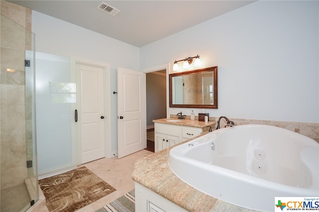 bathroom featuring independent shower and bath and vanity