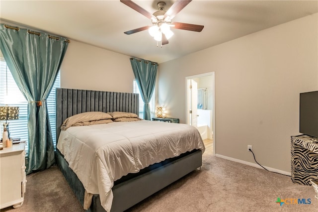 carpeted bedroom with ceiling fan and ensuite bathroom