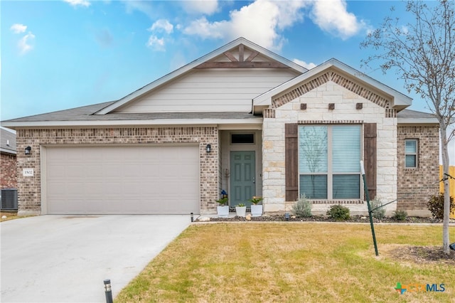 view of front of house with a garage and a front yard