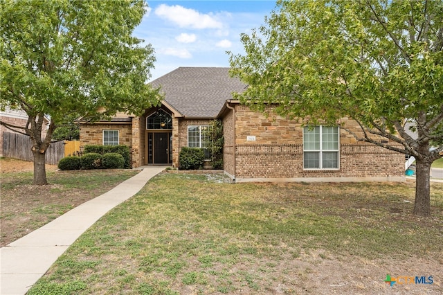 view of front of home with a front lawn