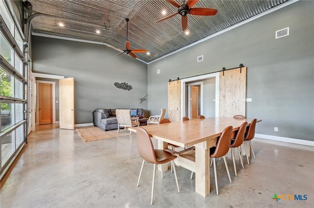 dining area with high vaulted ceiling, finished concrete flooring, and ceiling fan