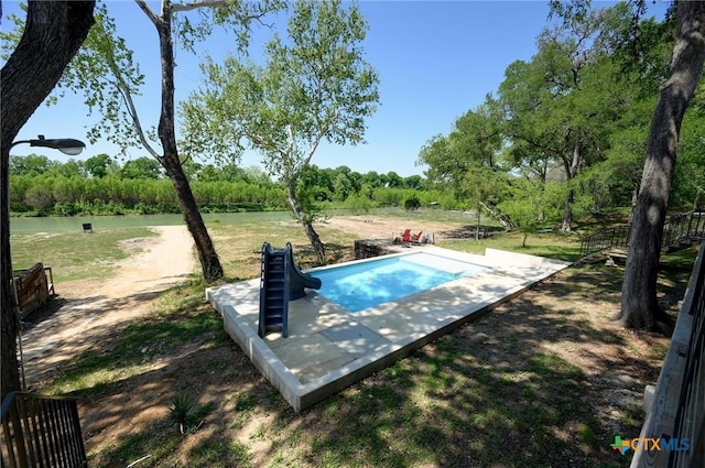 entry to storm shelter featuring a water view