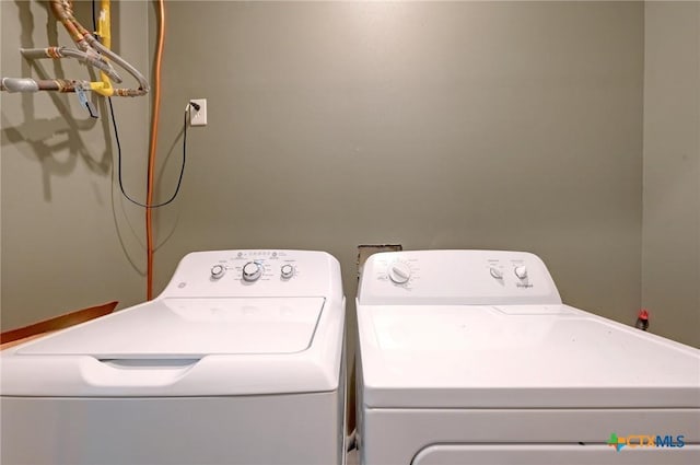 laundry room with washer and dryer
