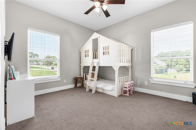 carpeted bedroom with ceiling fan