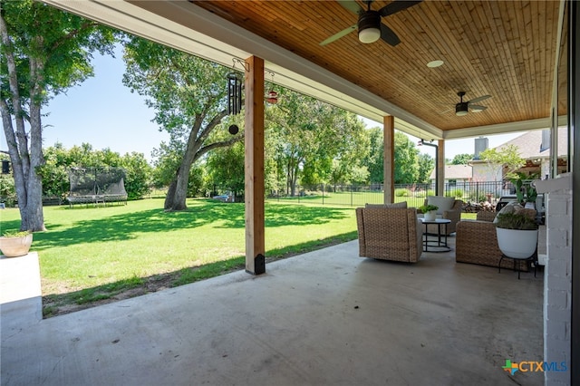 view of patio featuring ceiling fan and a trampoline