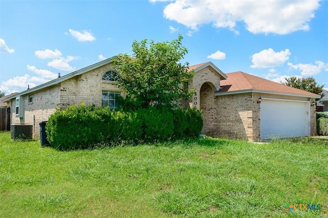 5005 Topsey Dr, Killeen, TX 76542 - single story home with brick siding, a garage, and a front yard