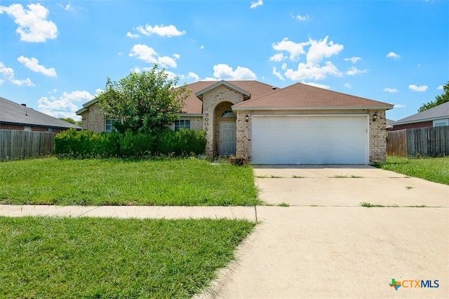 5005 Topsey Dr, Killeen, TX 76542 - single story home with driveway, a garage, and brick siding