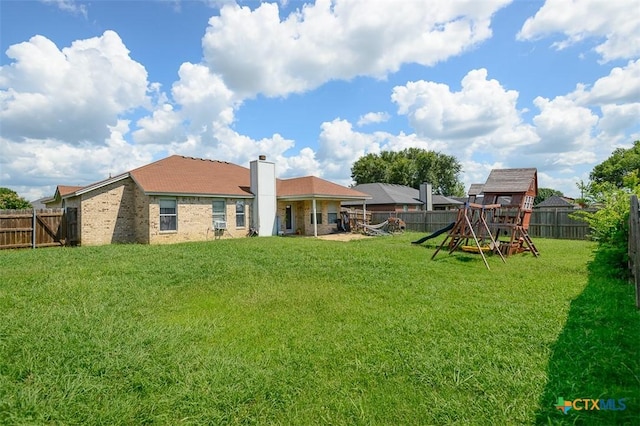5005 Topsey Dr, Killeen, TX 76542 - fenced backyard featuring a playground