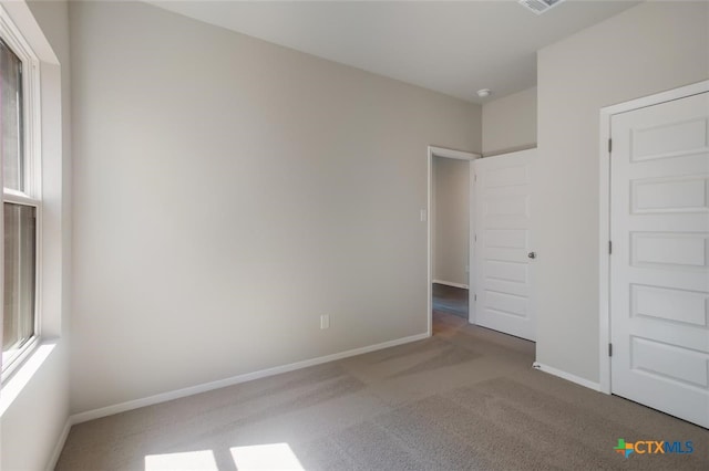 unfurnished bedroom featuring carpet