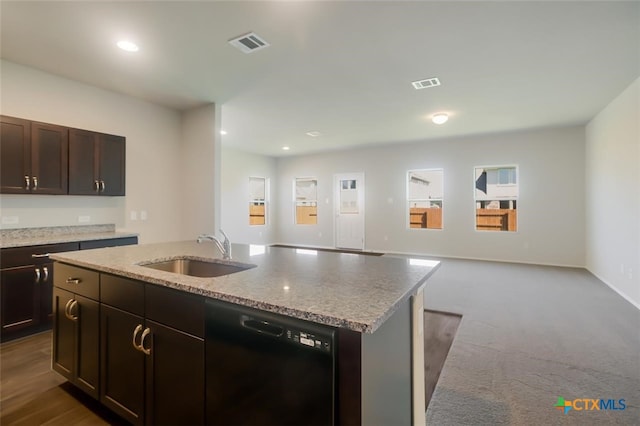 kitchen with dark carpet, dark brown cabinets, a kitchen island with sink, sink, and dishwasher