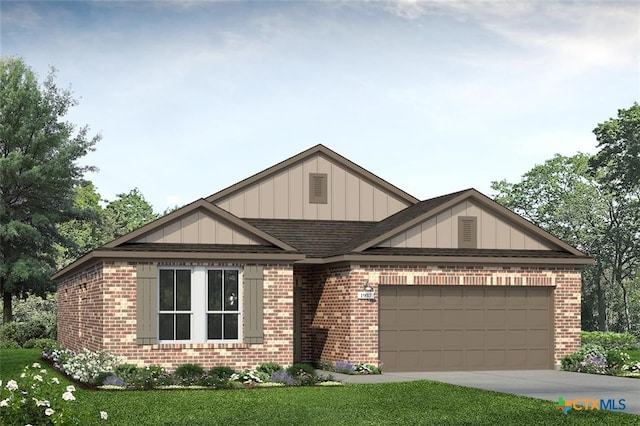 view of front of home featuring a front lawn and a garage