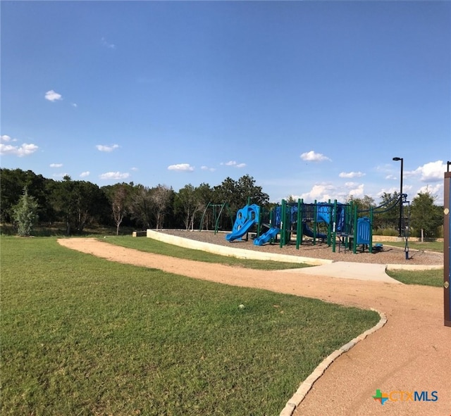 view of jungle gym with a lawn