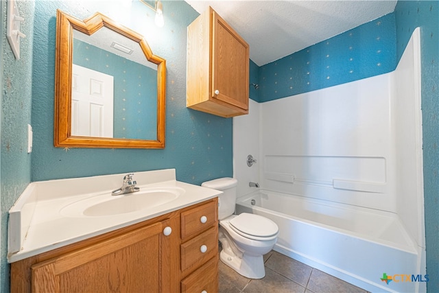 full bathroom featuring tile patterned flooring, a textured ceiling,  shower combination, vanity, and toilet