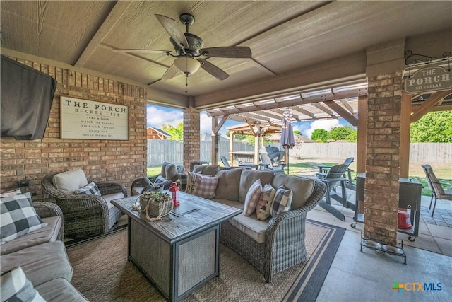 view of patio / terrace with a fenced backyard, a ceiling fan, and an outdoor hangout area