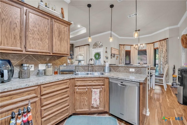 kitchen featuring a sink, dishwasher, a raised ceiling, a peninsula, and visible vents