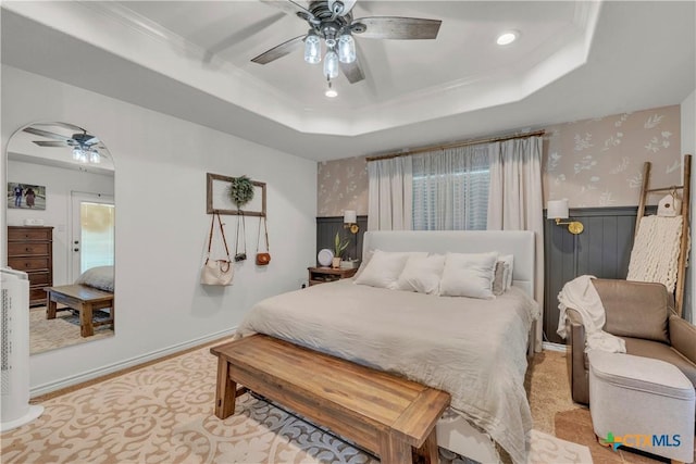 carpeted bedroom with recessed lighting, wallpapered walls, a raised ceiling, crown molding, and ceiling fan