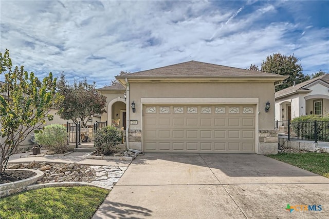 view of front of property featuring a garage