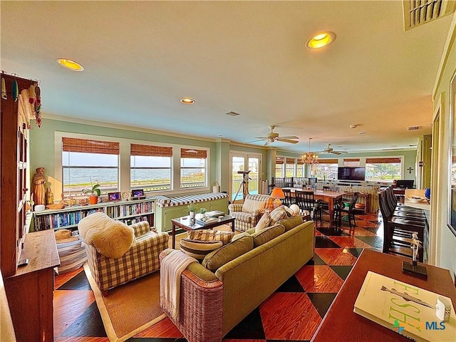 1007 N Washington Blvd, Port Oconnor, TX 77982 - living area featuring ceiling fan, recessed lighting, and crown molding