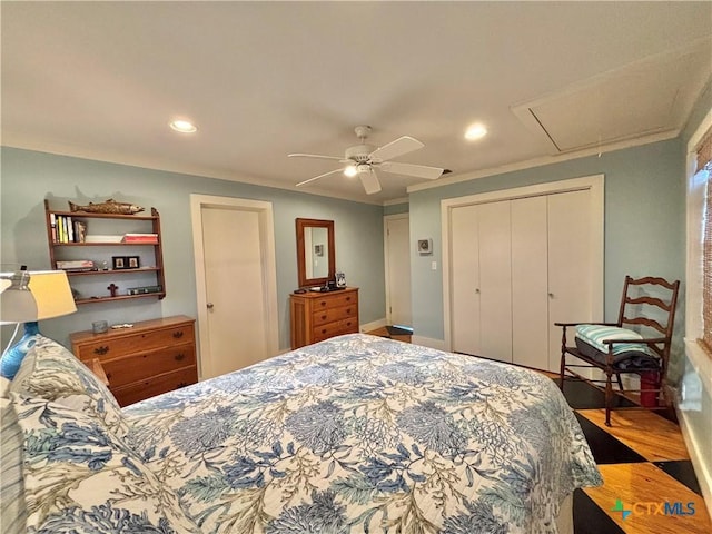 1007 N Washington Blvd, Port Oconnor, TX 77982 - bedroom featuring attic access, recessed lighting, a closet, wood finished floors, and ceiling fan