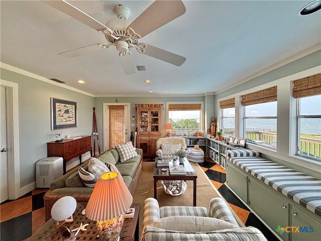 1007 N Washington Blvd, Port Oconnor, TX 77982 - living area featuring light wood finished floors, plenty of natural light, crown molding, recessed lighting, and a ceiling fan
