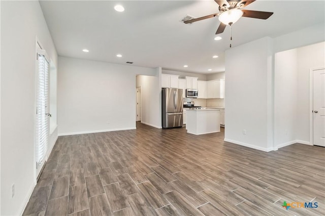 310 Spiny Lizard Ln, San Marcos, TX 78666 - unfurnished living room featuring ceiling fan, dark wood finished floors, baseboards, and recessed lighting