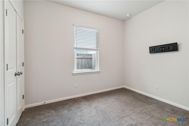 310 Spiny Lizard Ln, San Marcos, TX 78666 - unfurnished bedroom featuring carpet flooring and baseboards