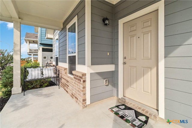 310 Spiny Lizard Ln, San Marcos, TX 78666 - doorway to property with covered porch and brick siding