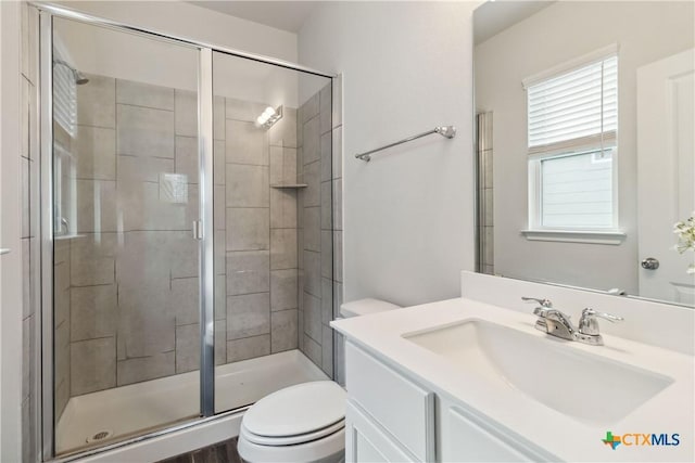310 Spiny Lizard Ln, San Marcos, TX 78666 - full bathroom featuring toilet, vanity, and a stall shower