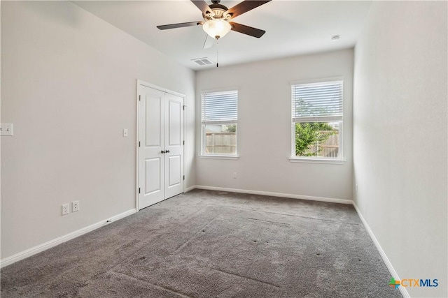 310 Spiny Lizard Ln, San Marcos, TX 78666 - unfurnished bedroom with carpet floors, baseboards, and a ceiling fan