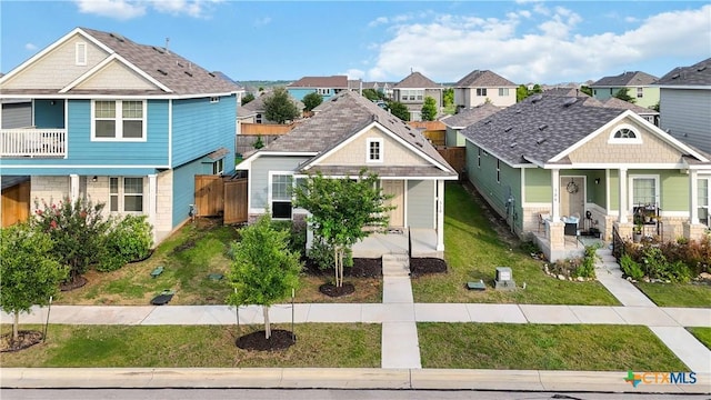 310 Spiny Lizard Ln, San Marcos, TX 78666 - view of front of home featuring a porch, a residential view, and a front yard