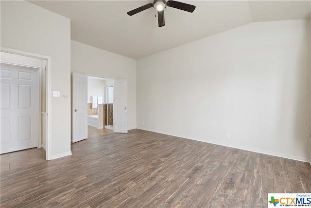 unfurnished room with dark hardwood / wood-style floors, vaulted ceiling, and ceiling fan