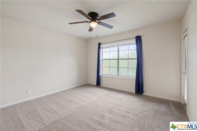 interior space with ceiling fan and light carpet