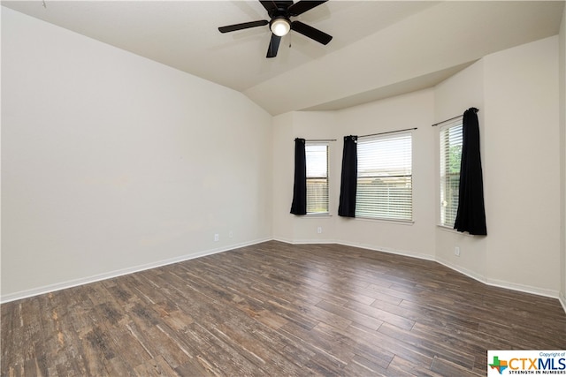 unfurnished room featuring ceiling fan, dark wood-type flooring, and vaulted ceiling