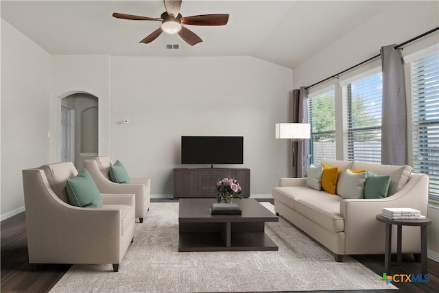 living room with hardwood / wood-style flooring, ceiling fan, and lofted ceiling