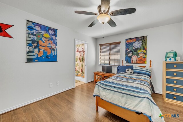 bedroom with hardwood / wood-style floors and ceiling fan