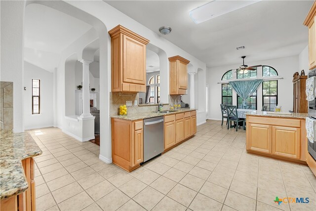 kitchen with stainless steel dishwasher, light brown cabinets, light tile patterned floors, and ceiling fan