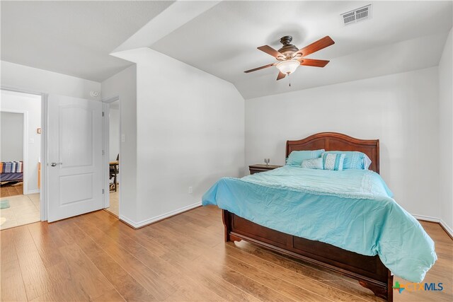 bedroom with ceiling fan and light wood-type flooring