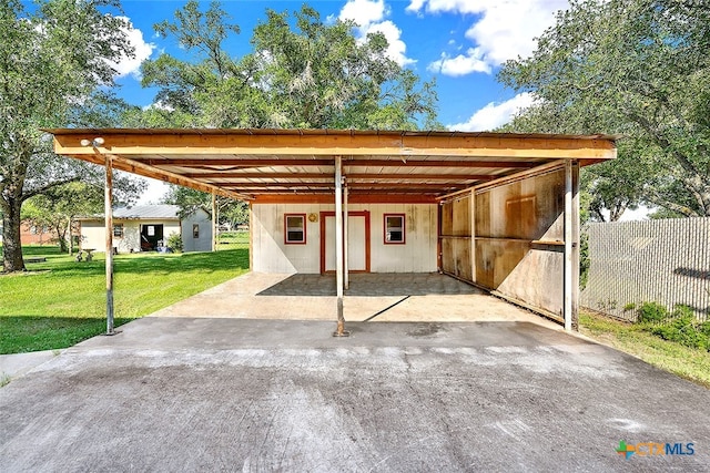 view of parking featuring a lawn and a carport