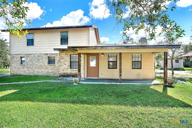 view of property with a front yard and a storage shed