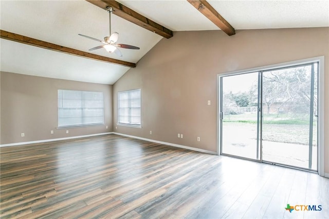 spare room with vaulted ceiling with beams, ceiling fan, baseboards, and wood finished floors