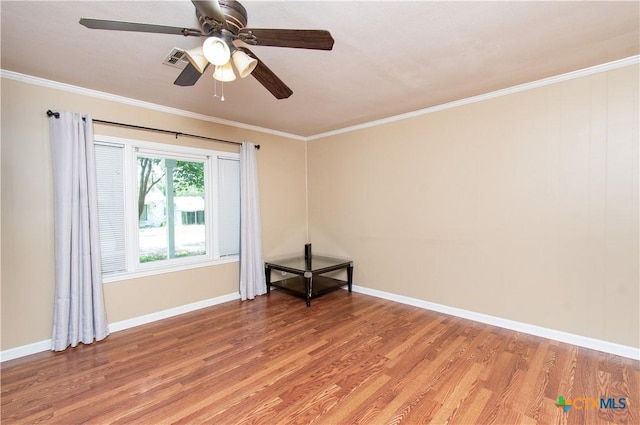 1401 N Penelope St, Belton, TX 76513 - spare room with light wood-style flooring, ornamental molding, and a ceiling fan