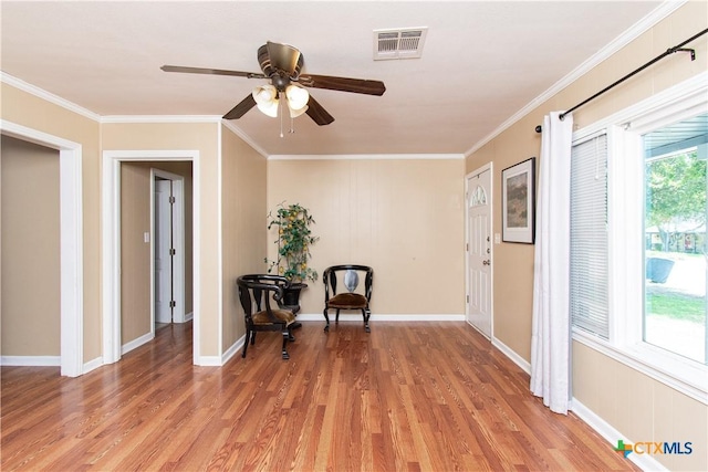 1401 N Penelope St, Belton, TX 76513 - sitting room featuring light wood-type flooring, a ceiling fan, and ornamental molding