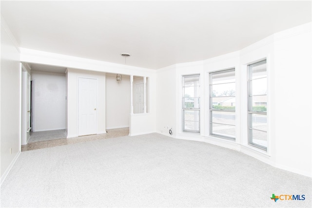 empty room featuring light colored carpet