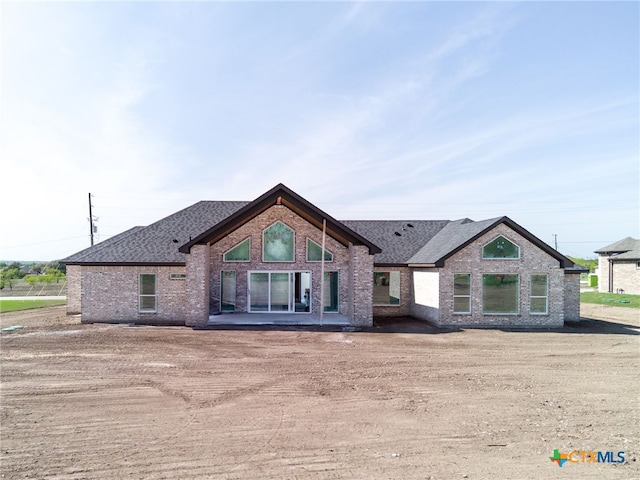 549 County Road 3152, Kempner, TX 76539 - rear view of house featuring brick siding and a shingled roof