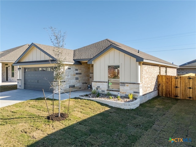 view of front of property with a garage and a front yard