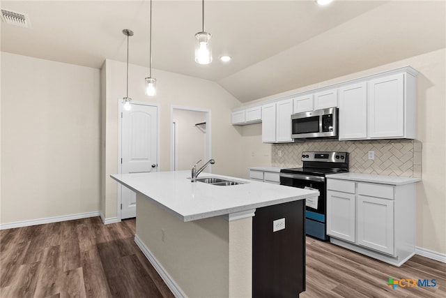 kitchen with stainless steel appliances, sink, white cabinetry, hanging light fixtures, and lofted ceiling