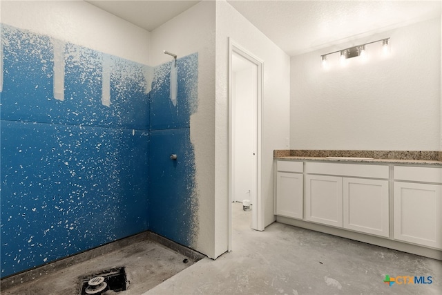 bathroom with concrete floors