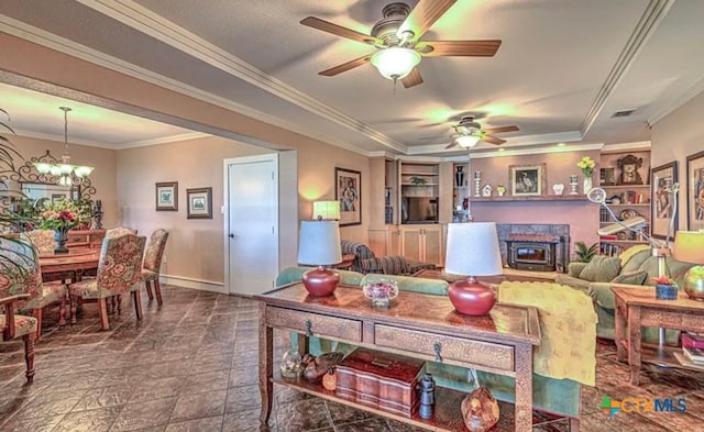 12337 Bonnie Ln, Belton, TX 76513 - living room with ceiling fan with notable chandelier, a wood stove, and crown molding