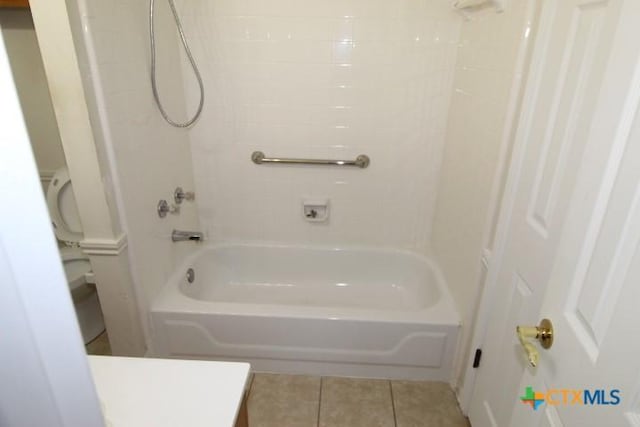 bathroom featuring tile patterned flooring, vanity, and shower / bath combination