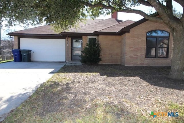 ranch-style house featuring a garage